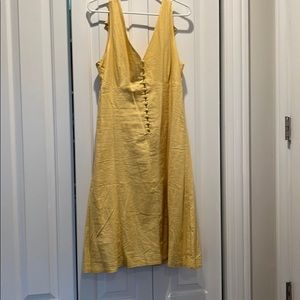 Yellow linen dress. Button front detail